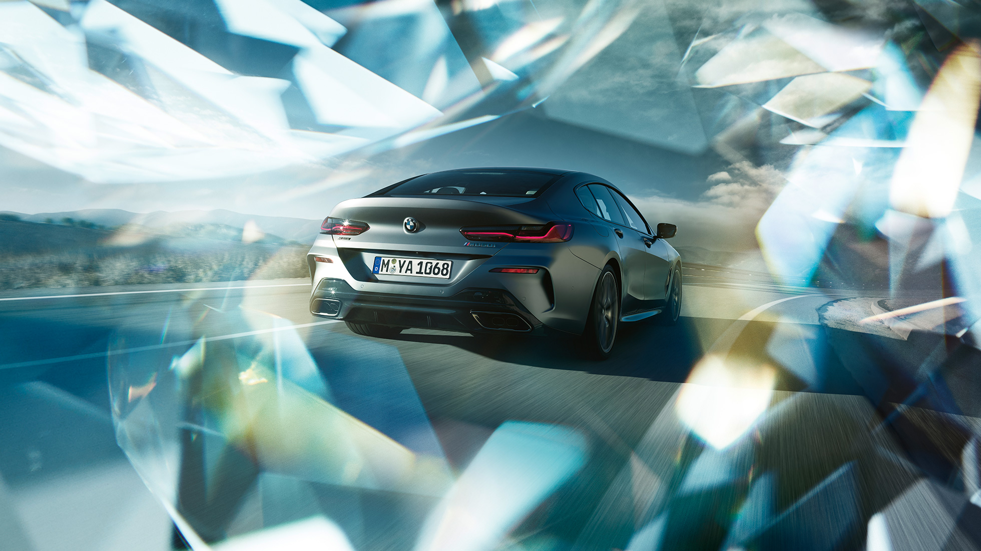BMW M850i xDrive Gran Coupe, вид сзади с поворотом в три четверти G16 BMW M850i xDrive Gran Coupe G16 2019 МГ цвета Серебристо-синий Камень (металлик) из линейки BMW Individual, вид сзади с поворотом в три четверти