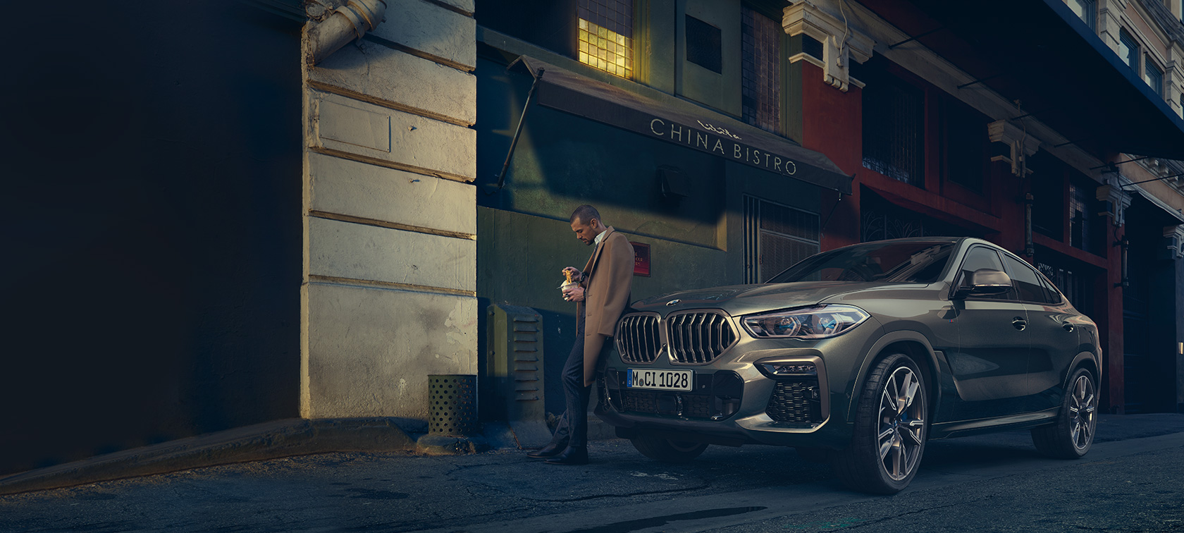 BMW X6, вид сзаду на три чверти в движении BMW X6 G06 2019 Manhatten metallic, вид сзаду на три чверти в движении